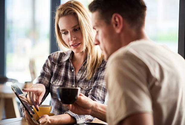 istock Young couple in cafeteria 614996310