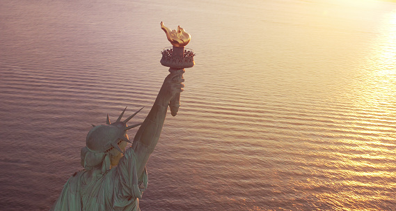Statue of Liberty at sunrise with copy space