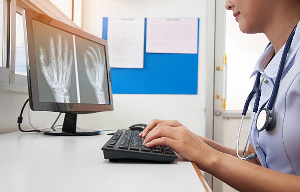 istock Doctor working with computer at desk in the hospital 615076076