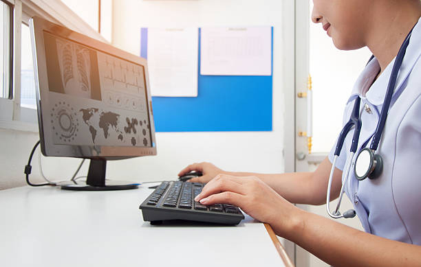 istock Doctor working with computer at desk in the hospital 615076172