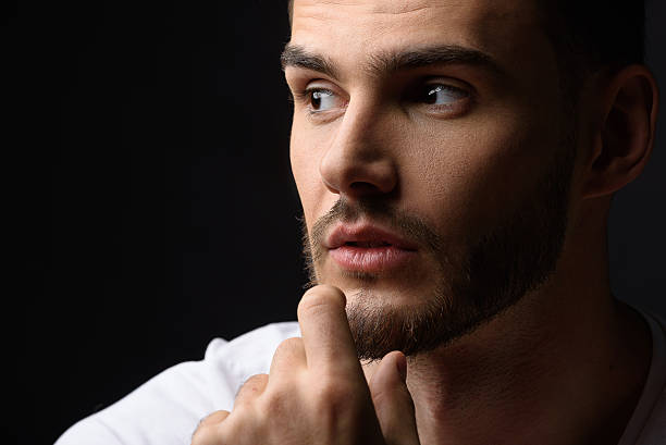 istock face of a calm man in studio 615077142