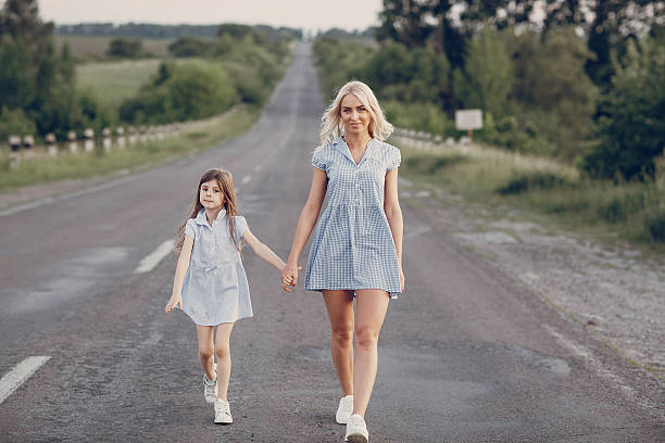 istock mom and daughter outside 615079098