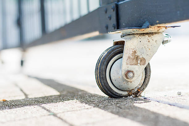 istock The castor rubber wheel under steel gate 615079710