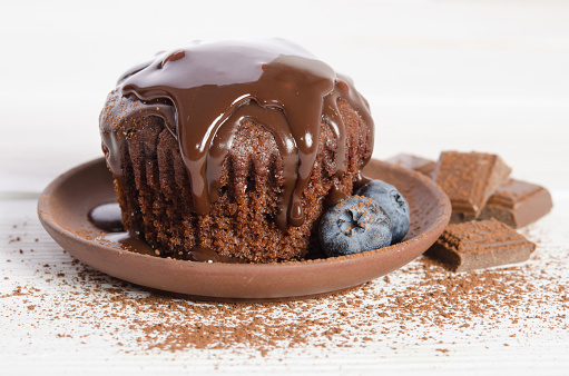 chocolate cupcake on wooden table