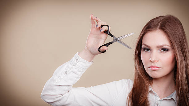 istock Young professional hairdresser with scissors. 615084166