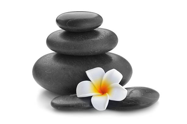 istock zen basalt stones and frangipani 615084648