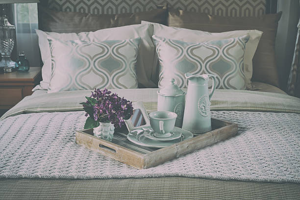 istock wood tray of tea cup set on bed 615085626