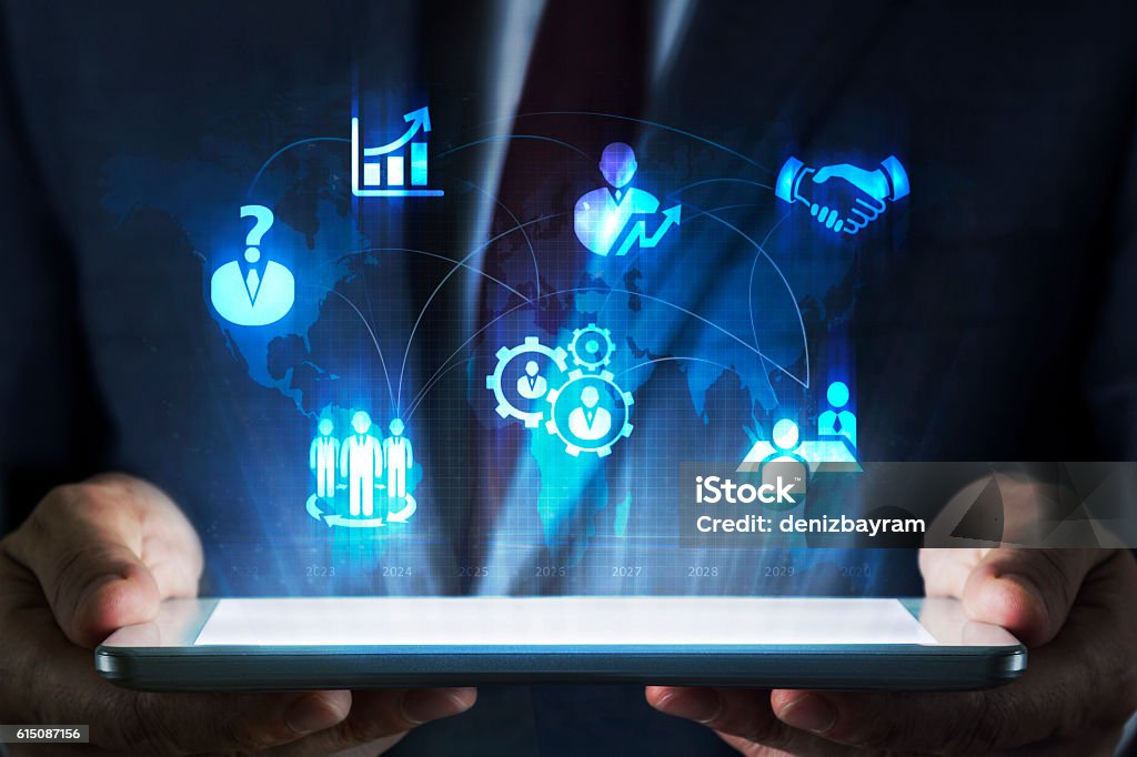 Human resources concept on tablet with hologram Insurance Stock Photo