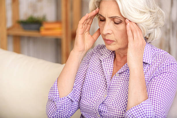 istock Old woman has terrible headache 615087934