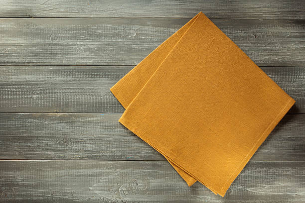 istock cloth napkin on wooden background 615088846
