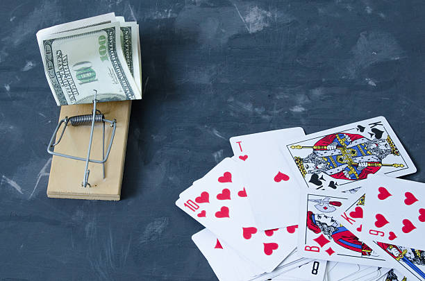 istock Mousetrap with money from the cards. 615088944