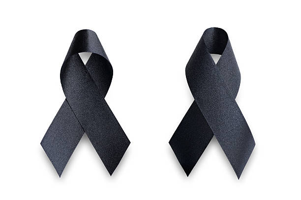 istock Black awareness ribbon.Mourning and melanoma symbol 615089114