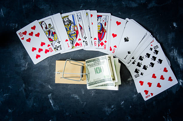 istock Mousetrap with money from the cards. 615089556