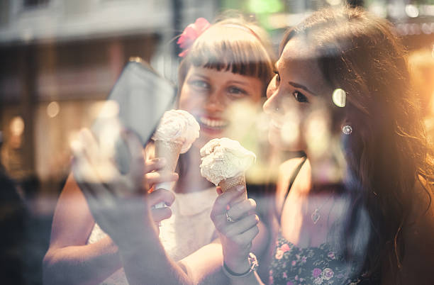 istock Two Girls Having Fun and Taking a Selfie 615092804