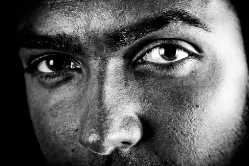 Man with intense eyes. High contrast black and white.