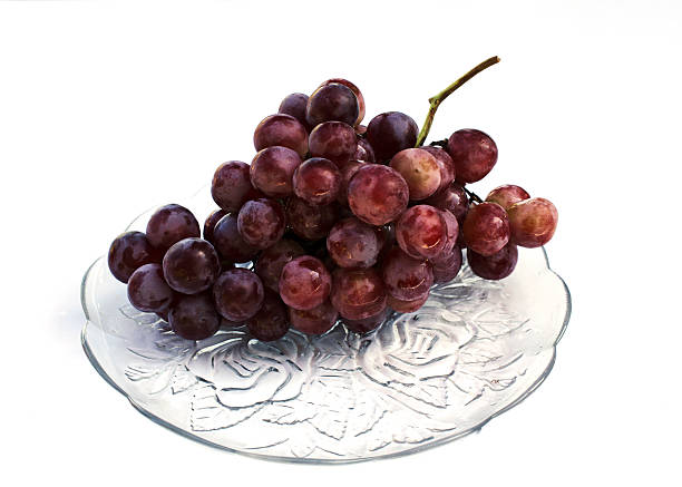 istock Grape fruits on dish isolatred on white backgrounds 615096434