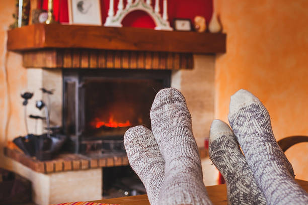 istock cozy family evening near fireplace 615097216