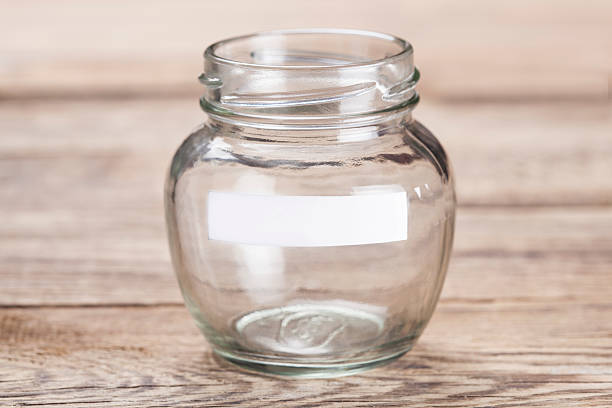 istock Glass on wood table. Money Saving concept 615097856
