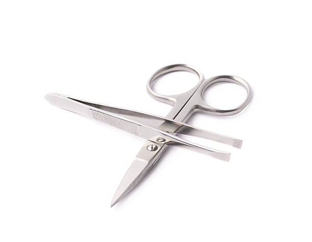 istock Tweezers and nail scissors isolated 615097858