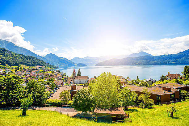 Landscape view on Weggis village on Lucerne lake with beautiful mountains on the background in Switzerland