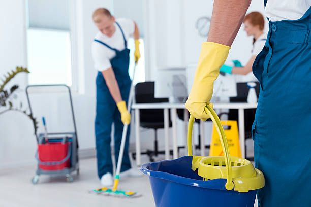 Person holding a mop pail Image of person holding mop pail and man cleaning floor cleaner stock pictures, royalty-free photos & images