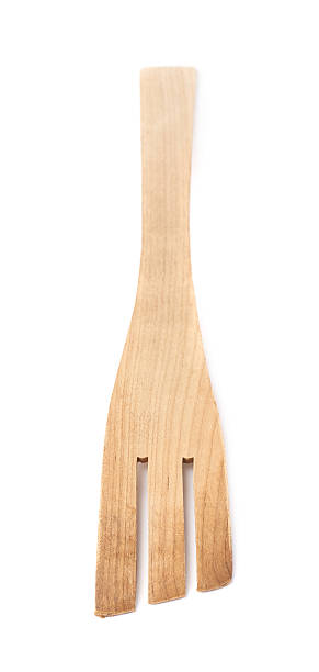 istock Used wooden fork spatula isolated 615098594
