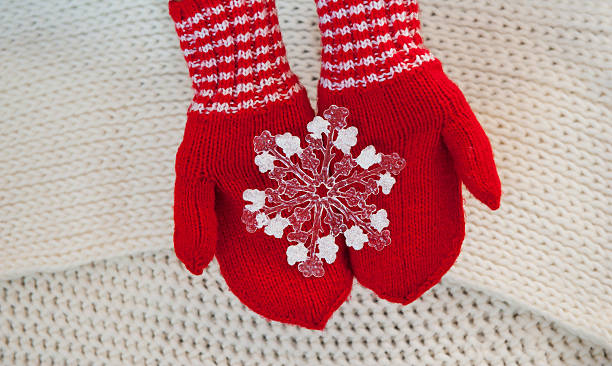 istock Christmas concept Red mittens with toy snowflake on a white 615098742