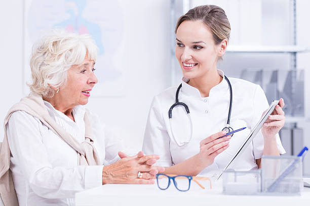 istock Doctor  talking with the senior woman 615099646