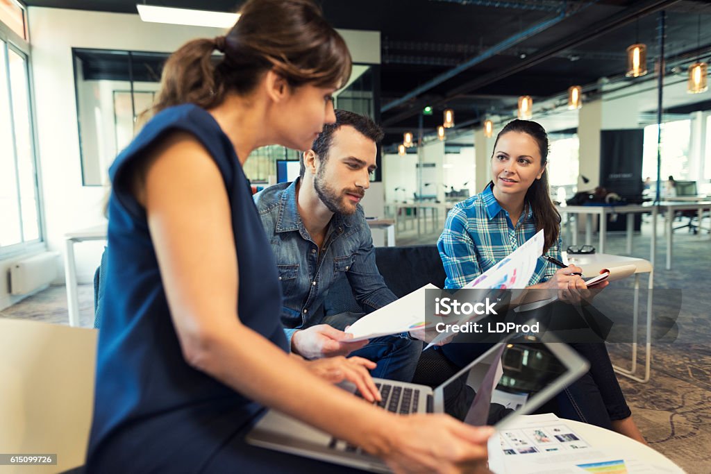 Collaborative teamwork in modern office space Collaborative teamwork in modern office space. Business woman manager working with her staff Design Stock Photo