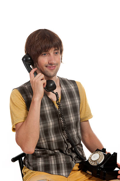 istock young man with an old phone in your hands 615100276