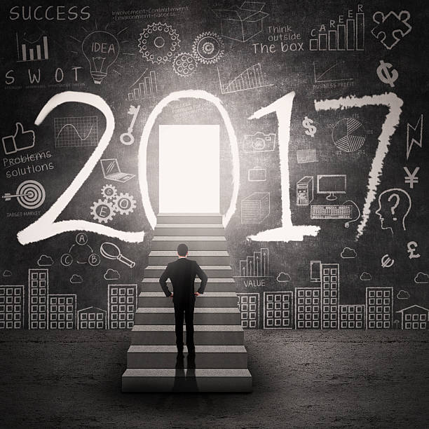 istock Businessman standing front of number 2017 615100724