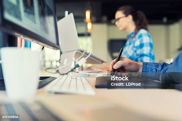 Man Working On Graphic Tablet In Modern Startup Stock Photo - Download Image Now - Real Estate Office, Design, Creativity