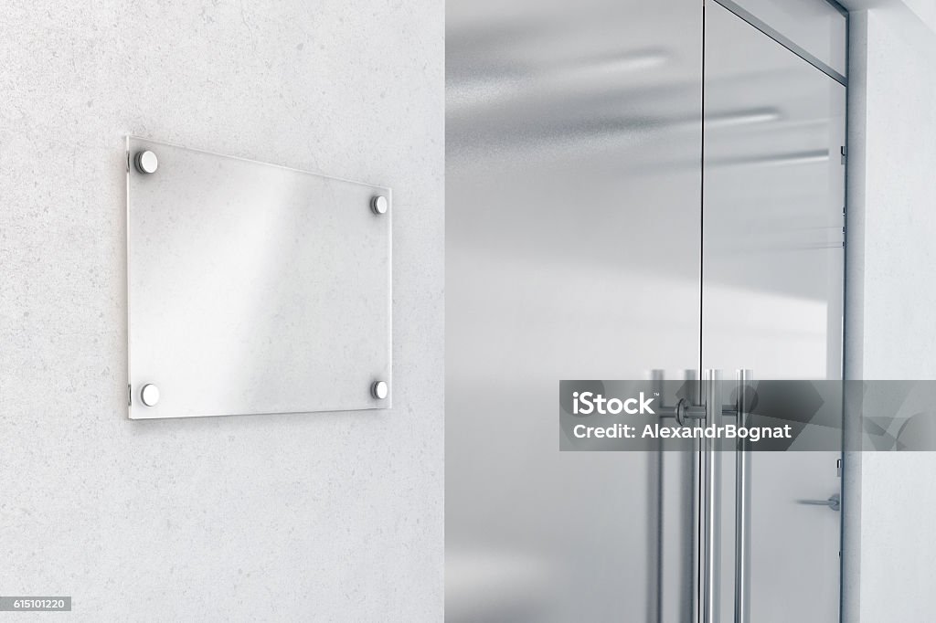 Blank glass nameplate design mockup, 3d rendering Blank glass nameplate design mockup, 3d rendering. Signplate mock up on the wall near office entrance interior. Signage panel door number template. Clear printing sign board for branding near store. Office Stock Photo