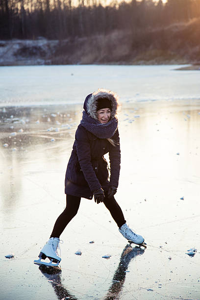 istock Ice skating on the frozen lake 615101754