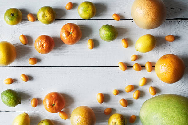 istock Citrus mix on the white wooden background 615103572