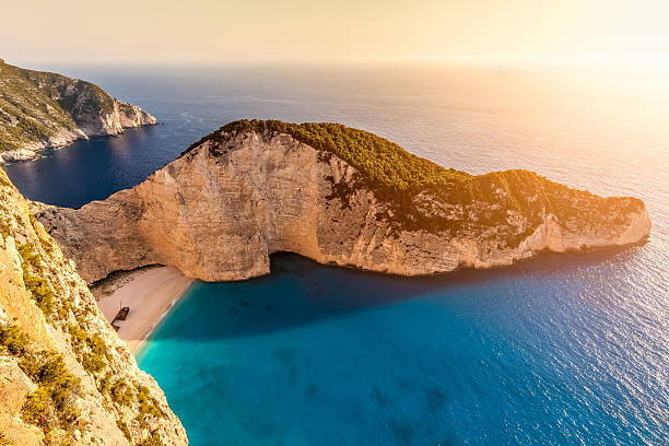 istock Sunset at Navagio beach with shipwreck view, Zakynthos, Greece 615104516