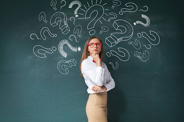 istock Businesswoman and question mark on blackboard 615107248