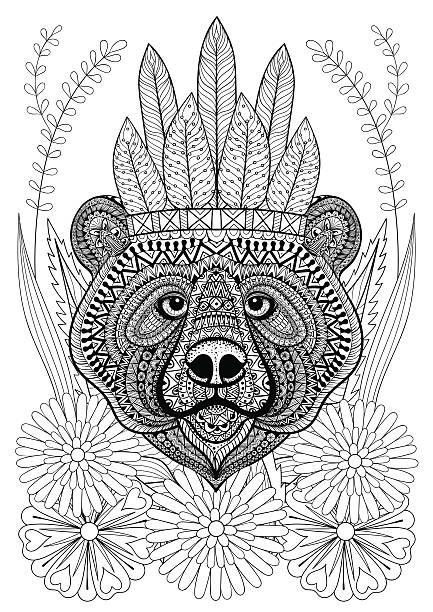 Bear with war bonnet on flowers. Bear with war bonnet on flowers. Hand drawn ethnic animal for adult coloring pages, art therapy, boho t-shirt print, posters, t-shirt. Vector isolated illustration. A4 size. war bonnet stock illustrations