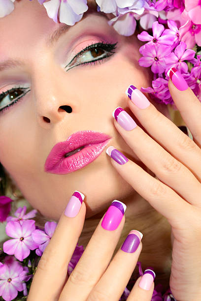 Manicure and makeup with phloxes. The French pink lilac manicure and makeup with phloxes on the girl. artificial flower stock pictures, royalty-free photos & images