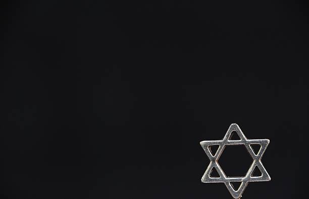 istock Star of David isolated on black 615111638
