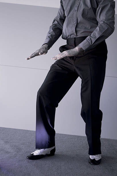 istock Man with black and white male dancing shoes 615111650