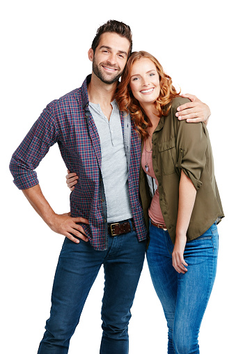 Shot of a couple posing against a white background
