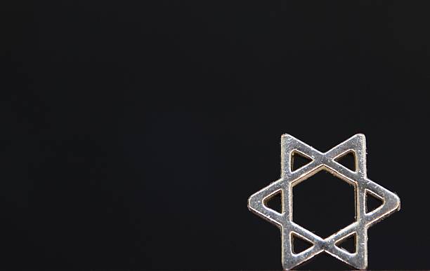 istock Star of David isolated on black 615112264