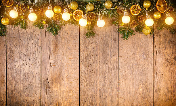 istock Christmas colored lights with decoration on wood 615113992