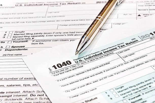 istock Pen on the tax form 615115894