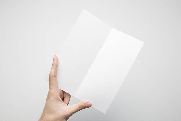 istock Hands are holding a Dl Bi-Fold white paper poster. 615116616