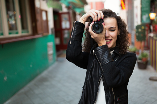 Woman traveling and taking pictures outdoors