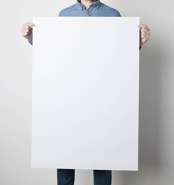Man holding a white poster stock photo