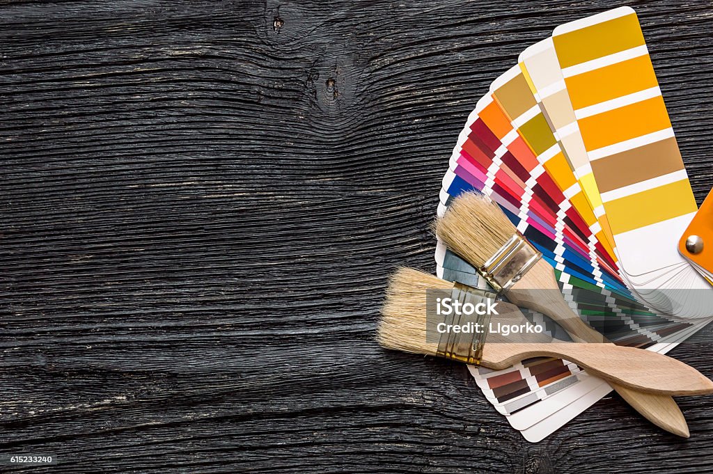 Brushes on a color swatches book Home Improvement Stock Photo