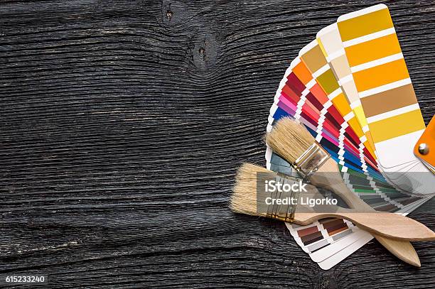 Brushes On A Color Swatches Book Stock Photo - Download Image Now - Home Improvement, Color Swatch, Artist's Palette